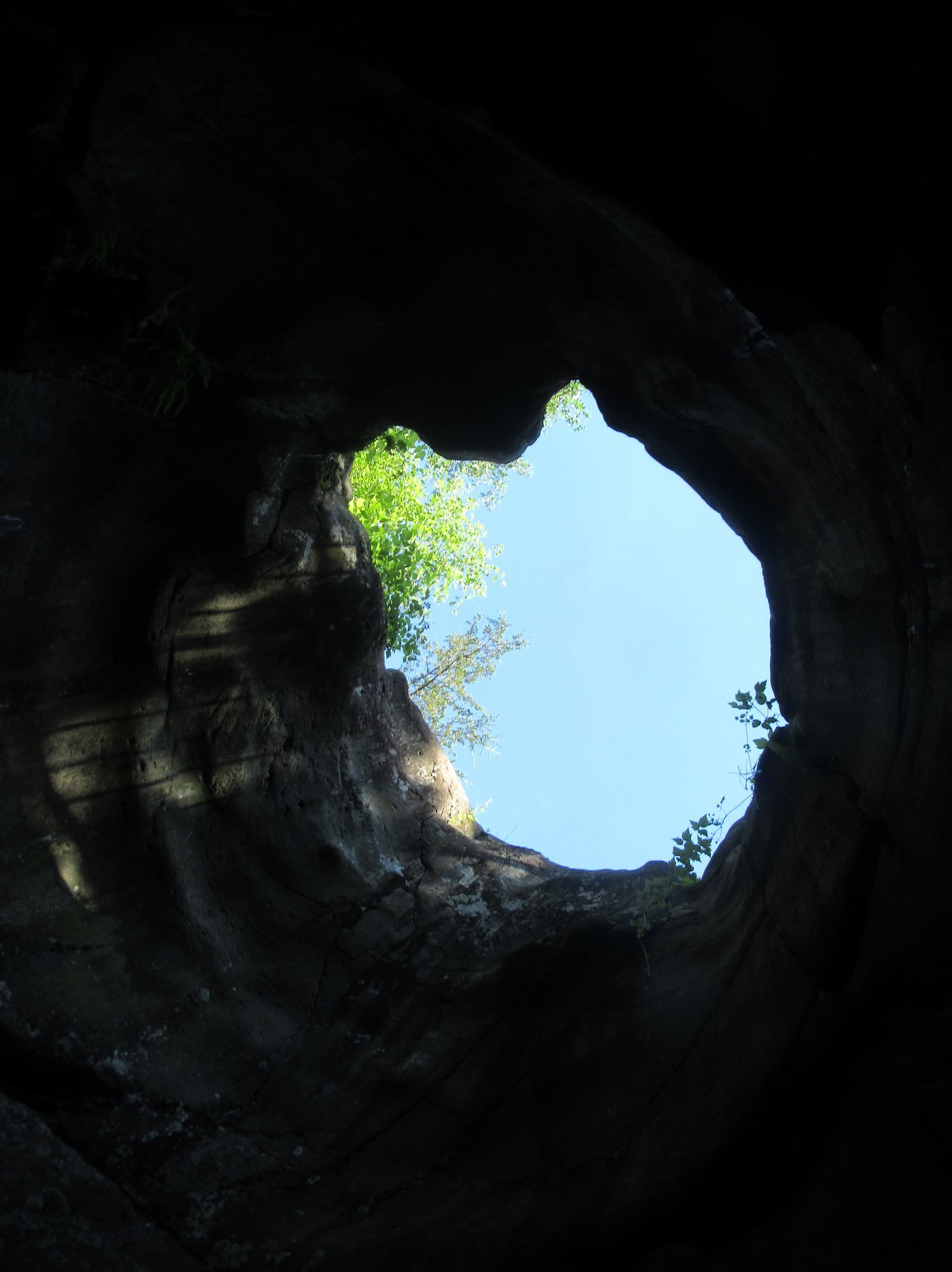 glowing hole of sunlight in a dark background