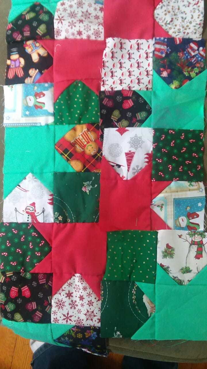 Ugly Christmas fabric mitigated slightly by bright red and green starbursts
