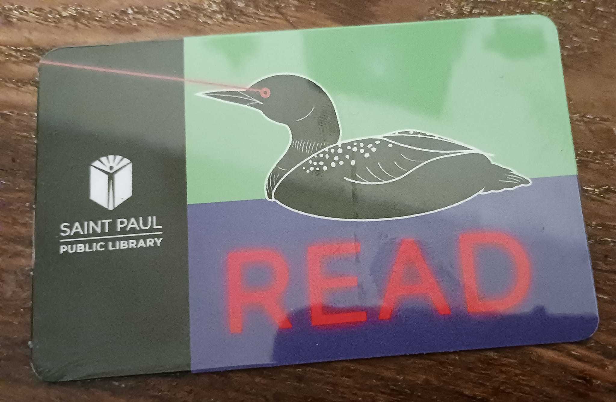 laser-eyed loon on library card