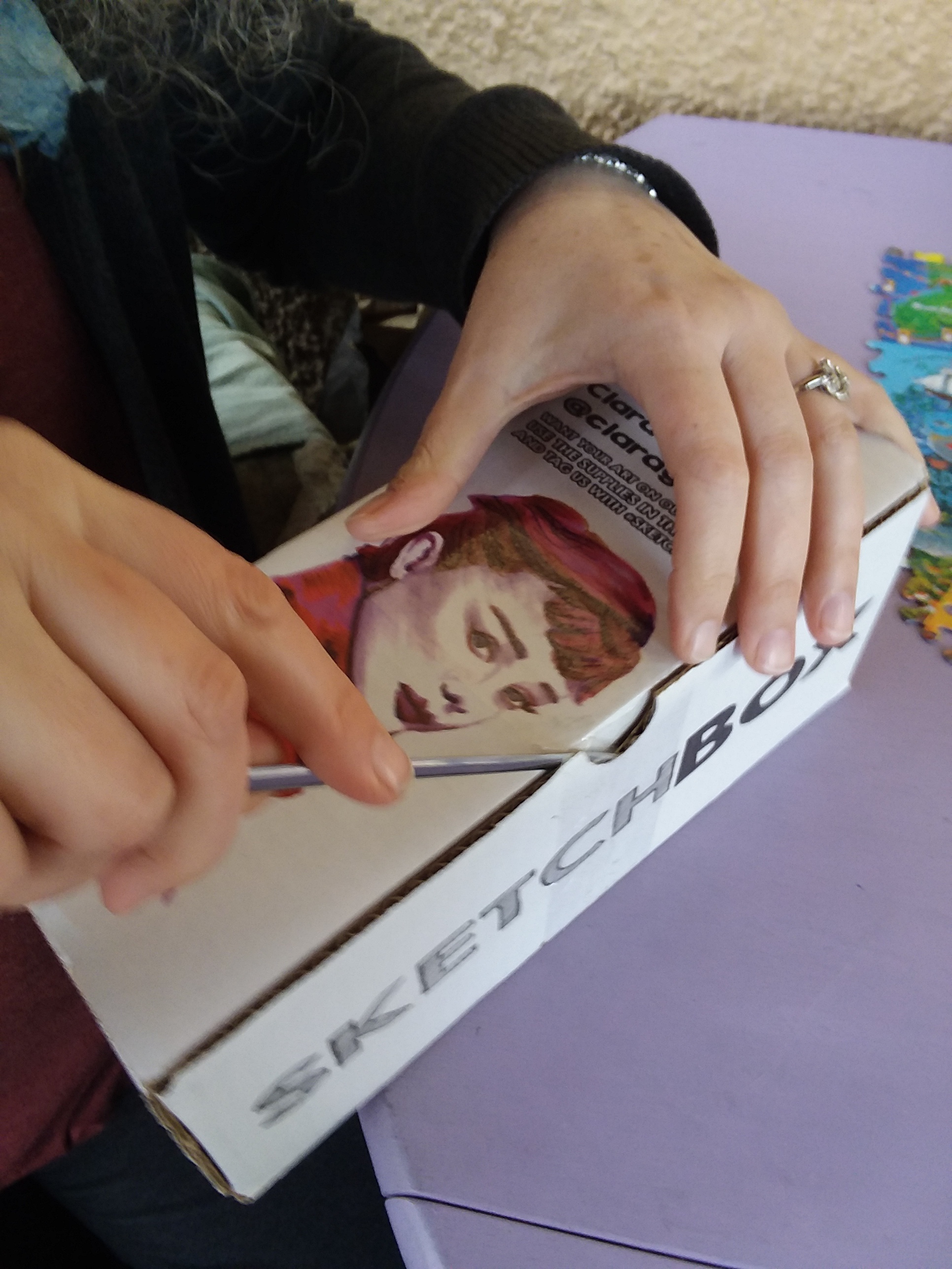 Shawn is opening a very cute box